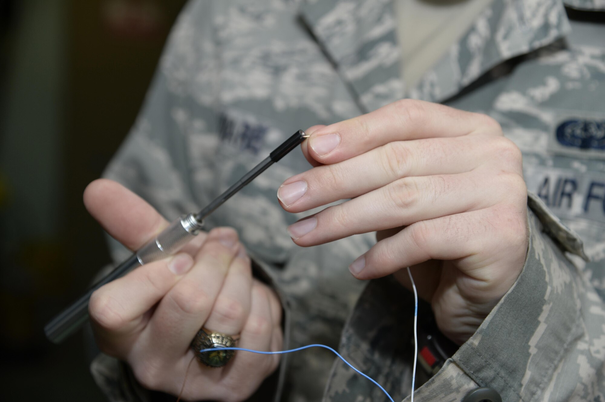 Senior Airman Christopher, client service technician, prepares wiring for a new telephone line at an undisclosed location in Southwest Asia March 30, 2015. The telephone section supports all the telephones on base that are not voice over internet protocol telephones. Christopher is currently deployed from Mountain Home Air Force Base, Idaho. (U.S. Air Force photo/Tech. Sgt. Marie Brown/RELEASED)