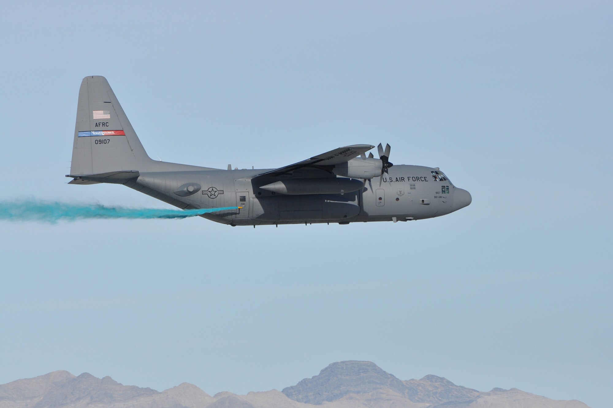 HILL AIR FORCE BASE, Utah – A modified Air Force Reserve C-130 Hercules tactical cargo aircraft, assigned to the 910th Airlift Wing, conducts aerial spray operations at an altitude of approximately 100 feet above the ground over a target site on the Utah Test and Training Range nearby here, March 18, 2015. The C-130 is flying at the low altitude to control the placement of herbicide onto the selected target areas while conducting a two-week aerial spray mission over UTTR, March 9 – 20, 2015, to eliminate the an unwanted invasive weeds. The 910th, based at Youngstown Air Reserve Station, Ohio, is home to the Department of Defense’s only large area, fixed wing aerial spray capability. 