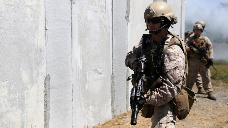 Staff Sgt. Kermit Hatfield, team leader, Charlie Company, 1st Reconnaissance Battalion, provides security during a live-fire raid at Range 226 aboard Camp Pendleton, Calif., April 1, 2015. Hatfield, a native of Butler, Ind., and the company conducted the live-fire exercise as part of a predeployment workup in support of the 13th Marine Expeditionary Unit. 