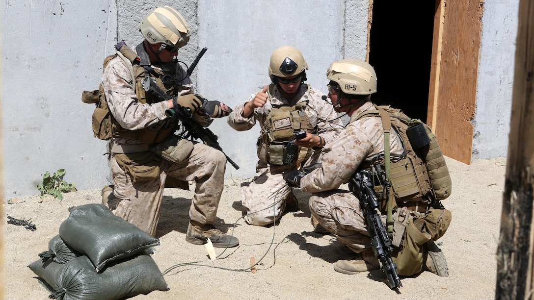 Marines with Charlie Company, 1st Reconnaissance Battalion, prepare a timed explosive during a live-fire raid at Range 226 aboard Camp Pendleton, Calif., April 1, 2015. The company conducted the live-fire exercise as part of a predeployment workup in support of the 13th Marine Expeditionary Unit. 