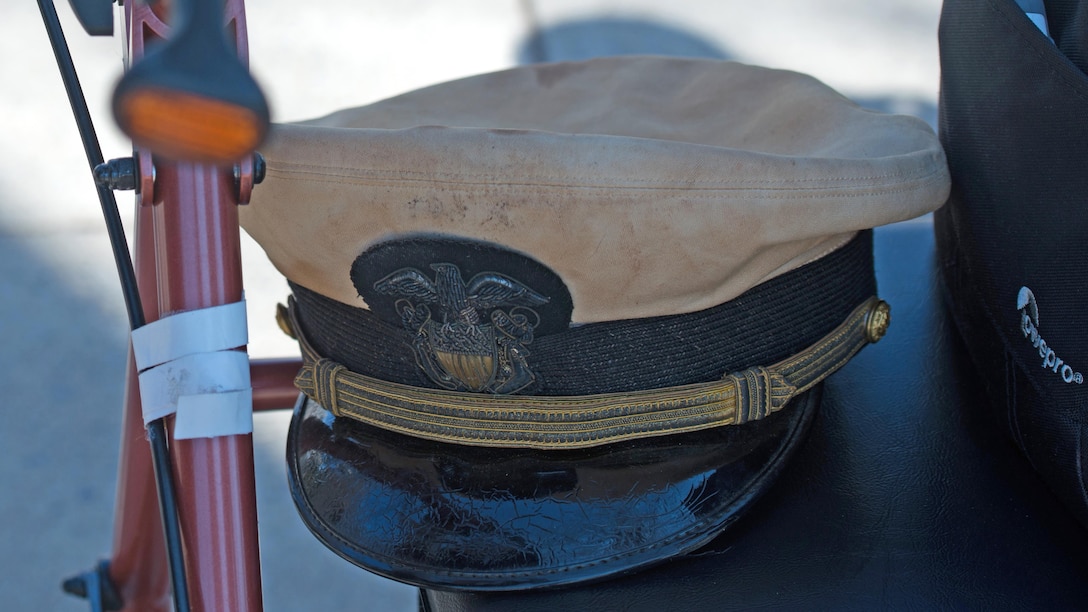World War II and Navy veteran John ‘Jack’ Cassidy’s, cover rests on a walker, during a wreath laying ceremony in honor of the 70th anniversary of the Battle of Okinawa at the World War II Memorial in Washington April 1, 2015. On April 1, 1945, allied forces invaded the island of Okinawa. The battle lasted 82 days amassed high totals of allied, Japanese and civilian casualties.