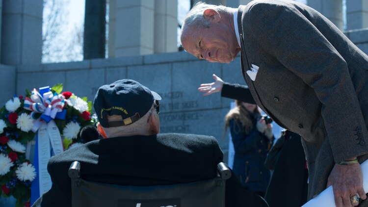 Josiah Bunting, Marine and Army veteran, speaks with John ‘Jack’ Cassidy, World War II and Navy veteran before a wreath laying ceremony in honor of the 70th anniversary of the Battle of Okinawa at the World War II Memorial in Washington D.C. on April 1, 2015. On April 1, 1945, allied forces invaded the island of Okinawa combated the Japanese in what would become the bloodiest battle of the Pacific theatre.
