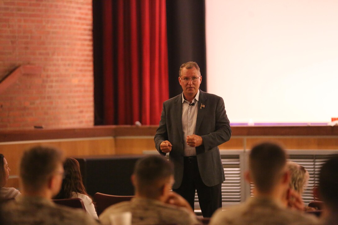 Best-selling author Dave Pelzer speaks to a crowd of Marines, Sailors and civilians during a visit to Marine Corps Air Station Cherry Point, N.C., April 1, 2015. 