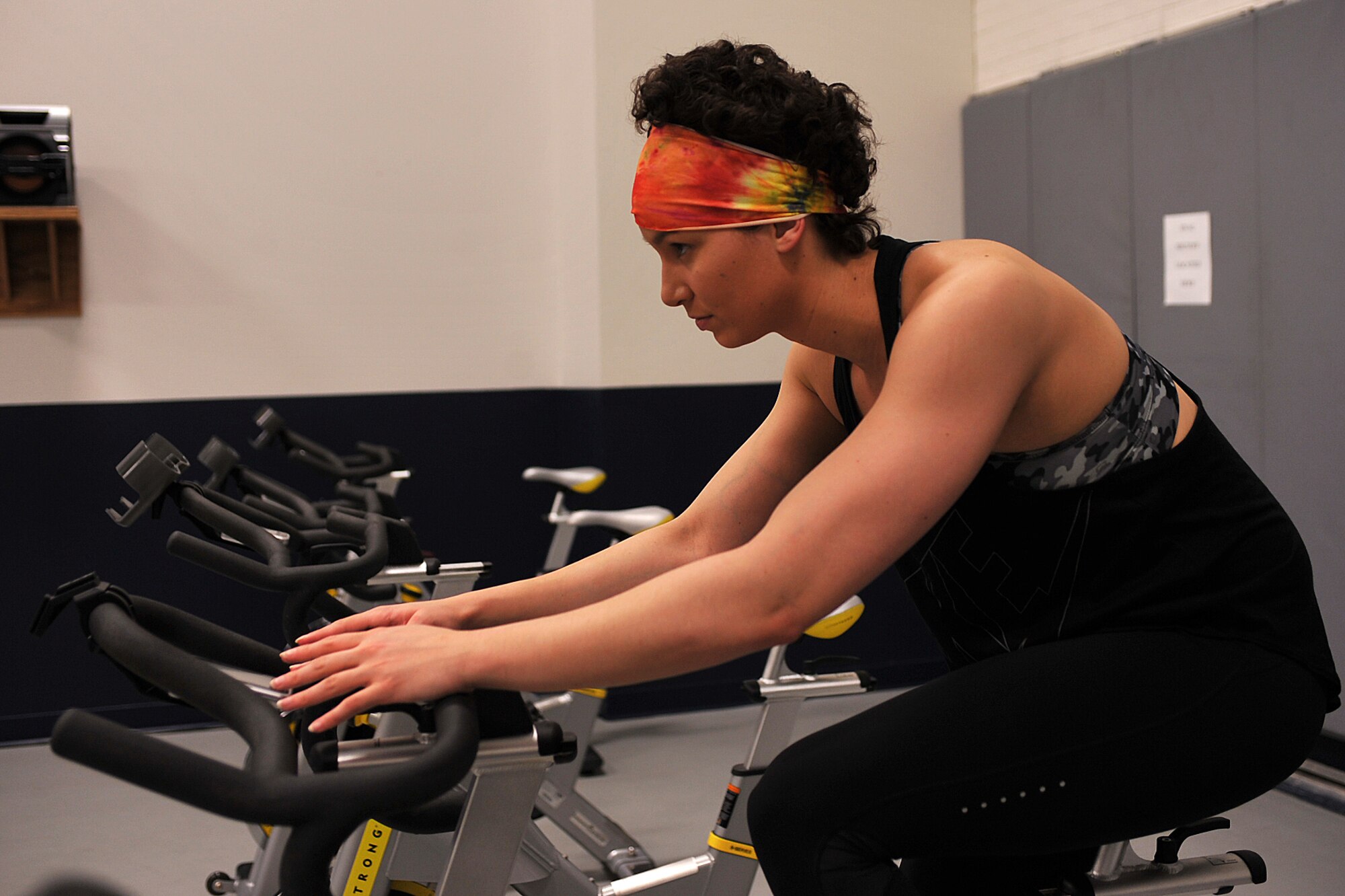 Senior Airman Myiah Castillejo, assigned to the 348th Reconnaissance Squadron on Grand Forks Air Force Base, N.D., uses cardiovascular exercise March 29, 2015, to maintain a healthy heart and healthy lungs after radiation treatment. The radiation was used in conjunction with chemotherapy to treat Hodgkin lymphoma. She was diagnosed in January 2014 and declared cancer free on Jan. 15, 2015. (U.S. Air Force photo/Airman 1st Class Bonnie Grantham)