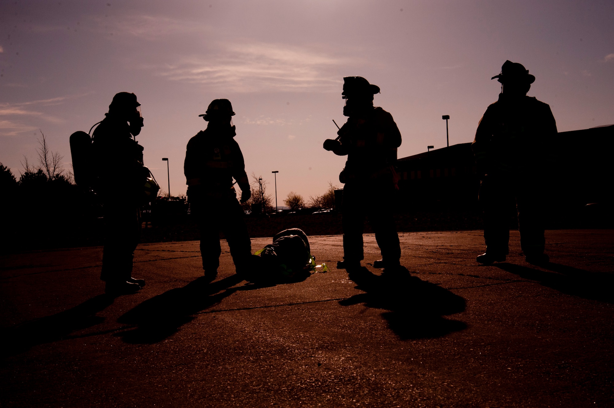Responders assess a simulated demolition site during an emergency management exercise March 30, 2015, at Fairchild Air Force Base, Wash. Firefighters, security forces and emergency medical services all took part in the exercise to assess their abilities to respond to real world events. (U.S. Air Force photo/Airman 1st Class Nicolo J. Daniello)