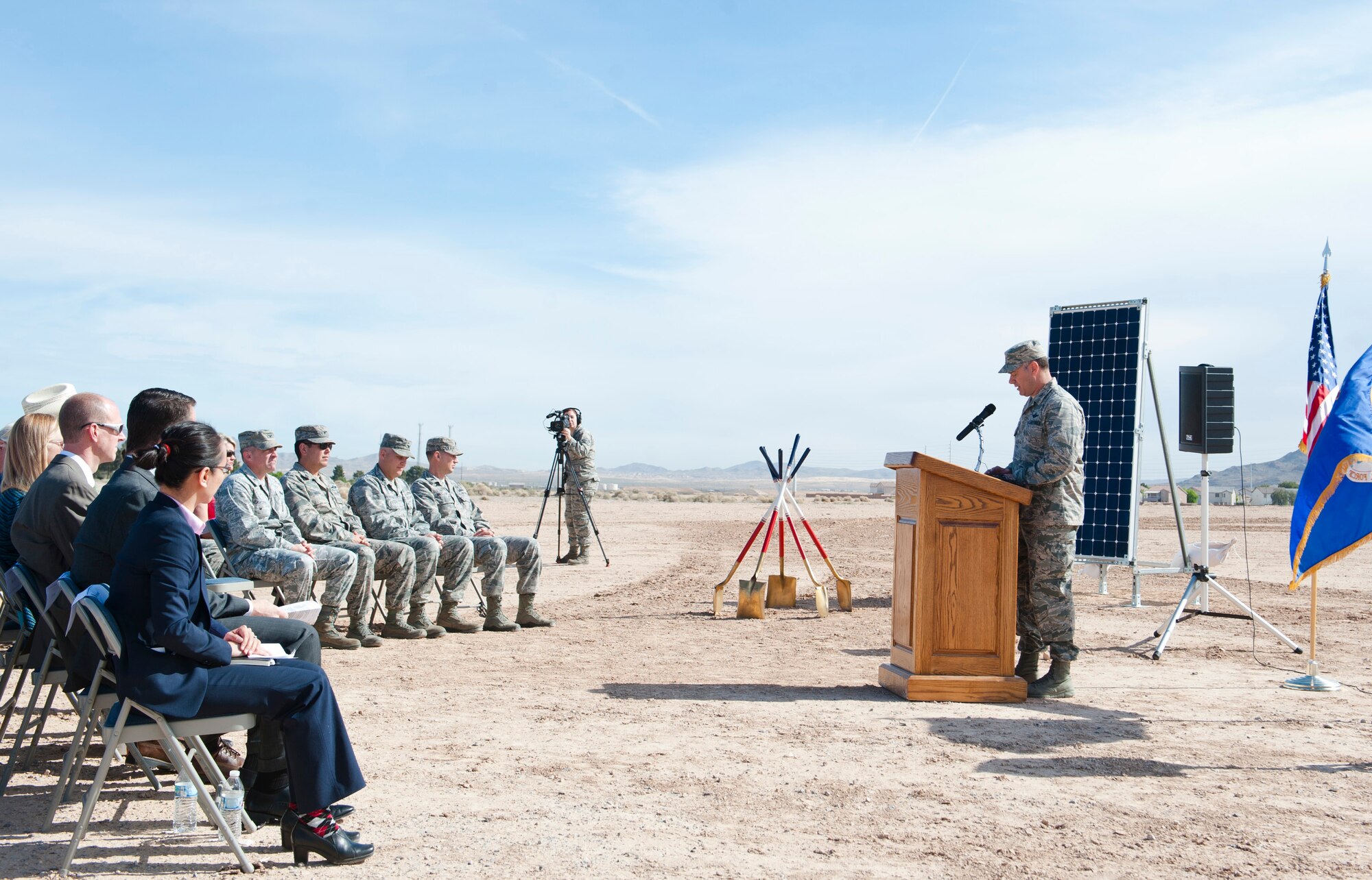Col. Richard Boutwell, 99th Air Base Wing commander, speaks at a ground breaking ceremony for a new solar array at Nellis Air Force Base, Nev., March 24, 2015. The new array will add to the power supply already being produced by the previous array located on the hospital side of Nellis. The 15-megawatt solar project will enable the base to run exclusively on renewable energy during the daylight hours. (U.S. Air Force photo by Senior Airman Thomas Spangler) 