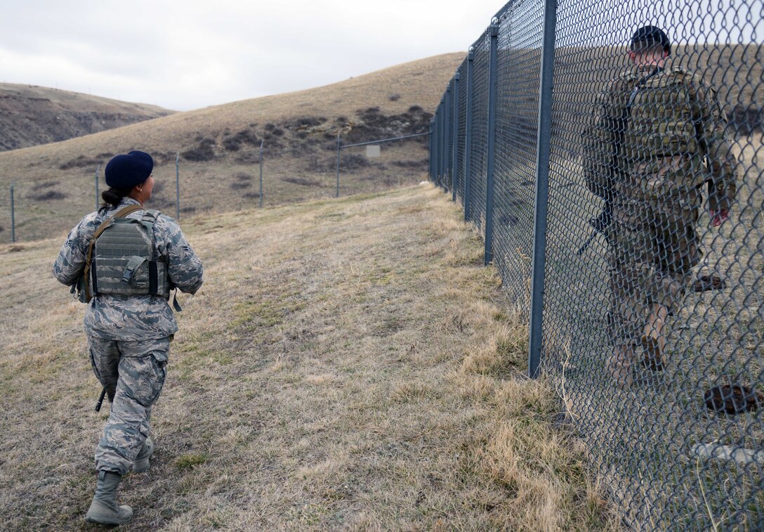 341st Missile Security Forces Squadron members perform a perimeter sweep March 16, 2015, at a missile alert facility near Malmstrom Air Force Base, Mont. Security forces members regularly check the perimeter for any signs of a breach, as well as cleanliness. (U.S. Air Force photo/Airman 1st Class Dillon Johnston)