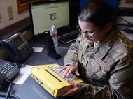 Senior Airman Emma Enos, 341st Missile Security Forces Squadron flight security controller, checks dispatch codes March 16, 2015, at a missile alert facility near Malmstrom Air Force Base, Mont. The FSC is responsible for communicating to all the launch facilities under the MAFs control, as well as dispatching Airmen to LFs with tripped alarms. (U.S. Air Force photo/Airman 1st Class Dillon Johnston)