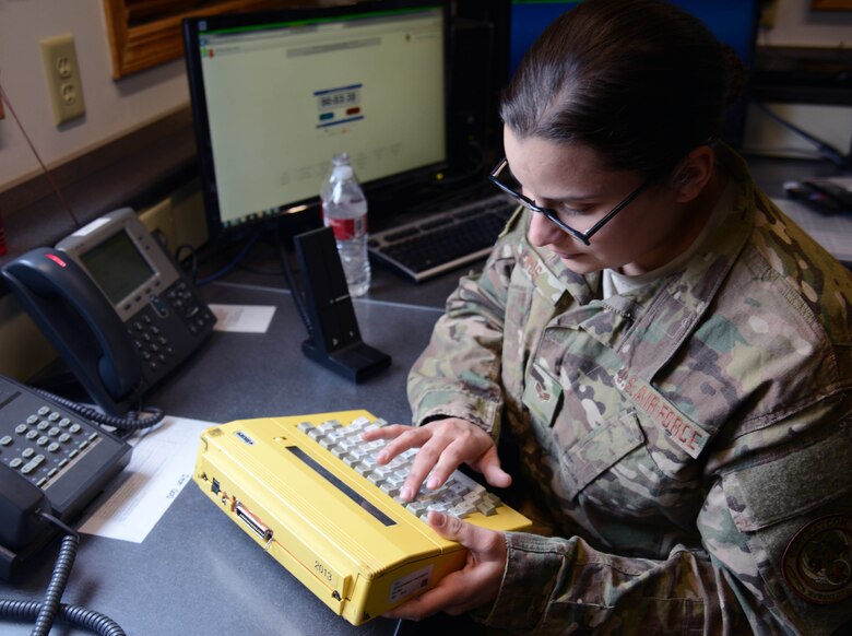 Senior Airman Emma Enos, 341st Missile Security Forces Squadron flight security controller, checks dispatch codes March 16, 2015, at a missile alert facility near Malmstrom Air Force Base, Mont. The FSC is responsible for communicating to all the launch facilities under the MAFs control, as well as dispatching Airmen to LFs with tripped alarms. (U.S. Air Force photo/Airman 1st Class Dillon Johnston)