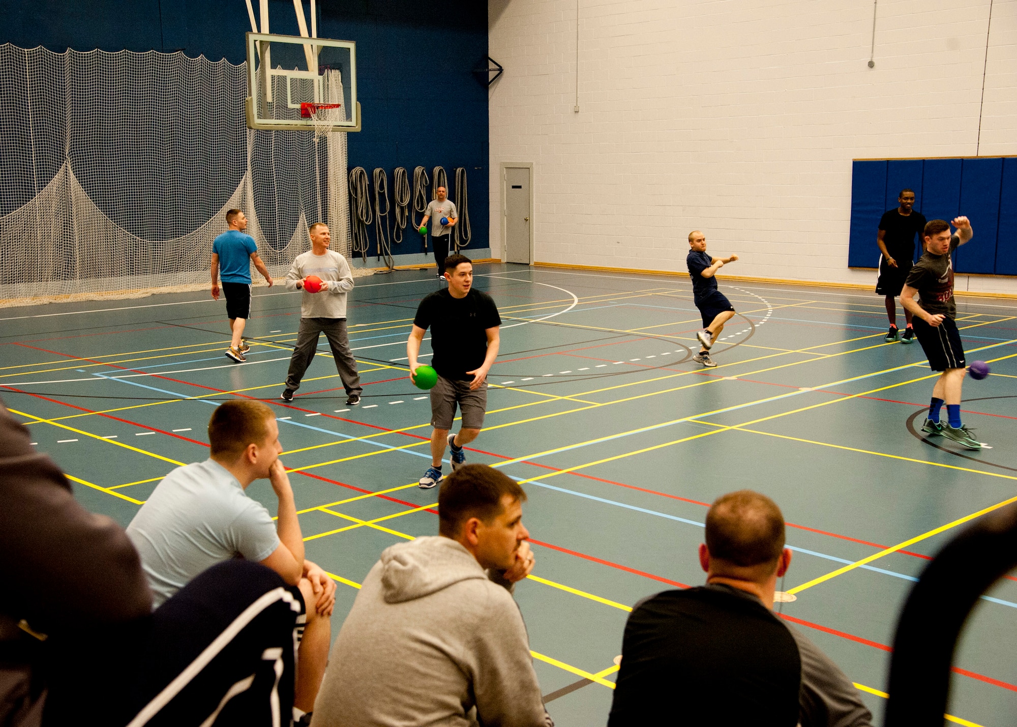 THULE AIR BASE, Greenland – Members of Thule AB watch a dodgeball game at the Thule Fitness Center March 20, 2015. The Rising Six council organizes various morale events on Thule AB, including a once-a-month sports day activity for the members of Team Thule. (U.S. Air Force photo by Senior Airman Tiffany DeNault)