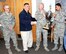 Fitness Center Director Steve Bowlin (second from left) presents the Kirtland Commanders Cup Trophy to Lt. Col. Bernabe Whitefield, 58th Aircraft Maintenance Squadron commander (second from right) and AMXS athletes Senior Airman Jason Thiele (left) and Staff Sgt. Santos Padilla (right). The squadron took the 2014 trophy for racking up the most points during intramural completion, winning a championship in softball, second place in volleyball and third place in basketball. (Photo by 
Jim Fisher)
