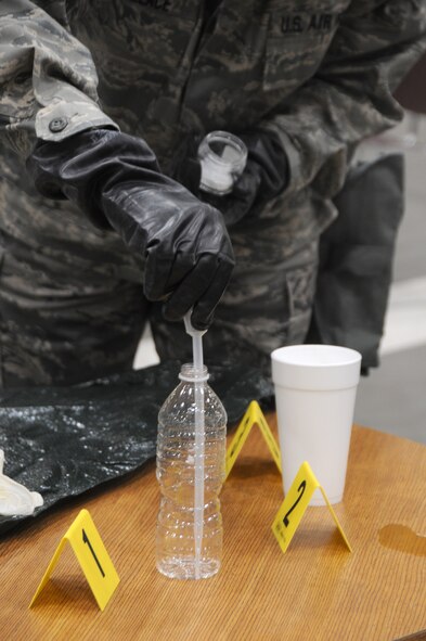 Senior Airman Keenan Wallace, 188th Wing emergency manager, samples unidentified substances during the Global Dragon deployment for training at the Guardian Center, Perry, Ga., March 10, 2015. The unidentified substances included liquids, powders and gels. Air National Guard emergency management technicians from all 10 Federal Emergency Management Agencies participated in Global Dragon. (U.S. Air National Guard photo by Senior Airman Cody Martin/released)