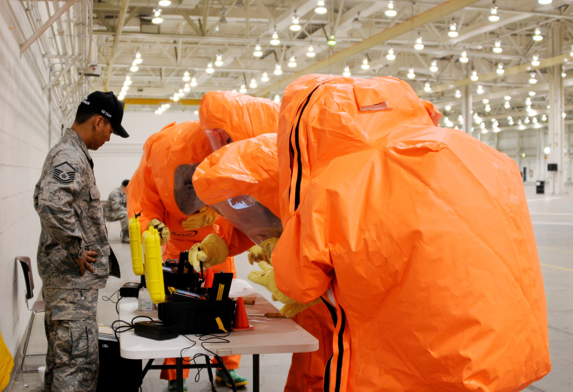 Master Sgt. Robby McGee assists emergency managers, from the Air National Guard, with the Hazmat ID 360 command system at the Guardian Centers, Perry, Ga., during Global Dragon deployment for training, March 9, 2015. The Hazmat ID is used to identify hazardous material which includes powders, liquids and gels.  McGee is a Global Dragon cadre assigned to the 188th Wing, Fort Smith, Ark. (U.S. Air National Guard photo by Staff Sgt. Hannah Dickerson/released)
