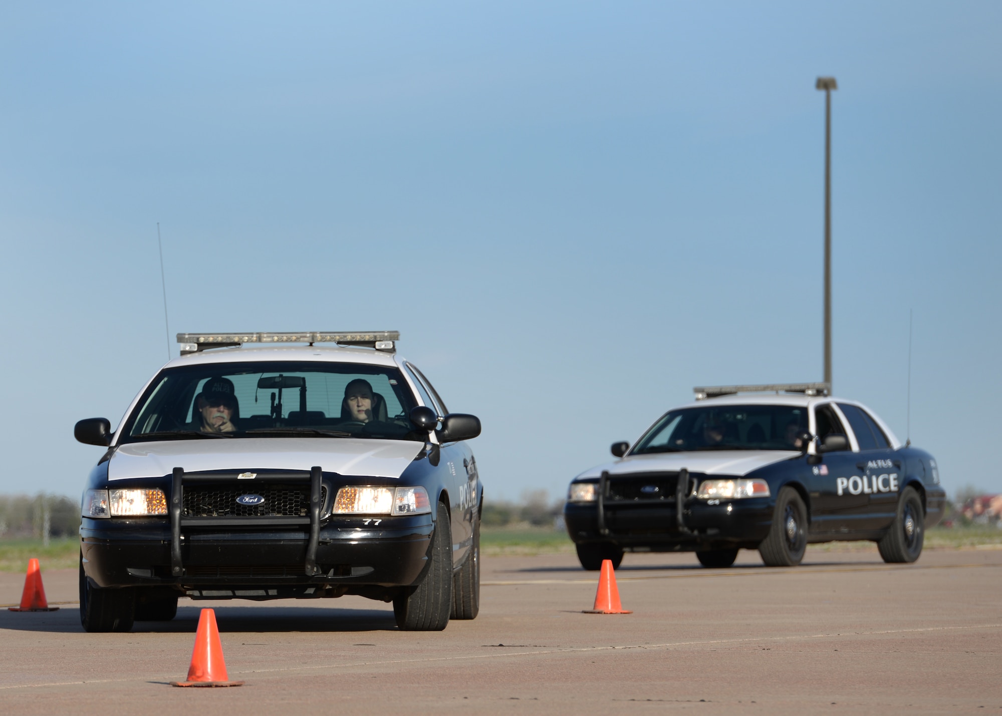 ALTUS AIR FORCE BASE, Okla. – U.S. Air Force Senior Airman Katie Wells, 97th Security Forces Squadron base defense operations controller, makes a tight turn in between cones, April 4, 2015. For this course, students zig-zagged around cones at close intervals at five, 10 and 15 miles per hour. (U.S. Air Force photo by Airman 1st Class Nathan Clark/Released)
