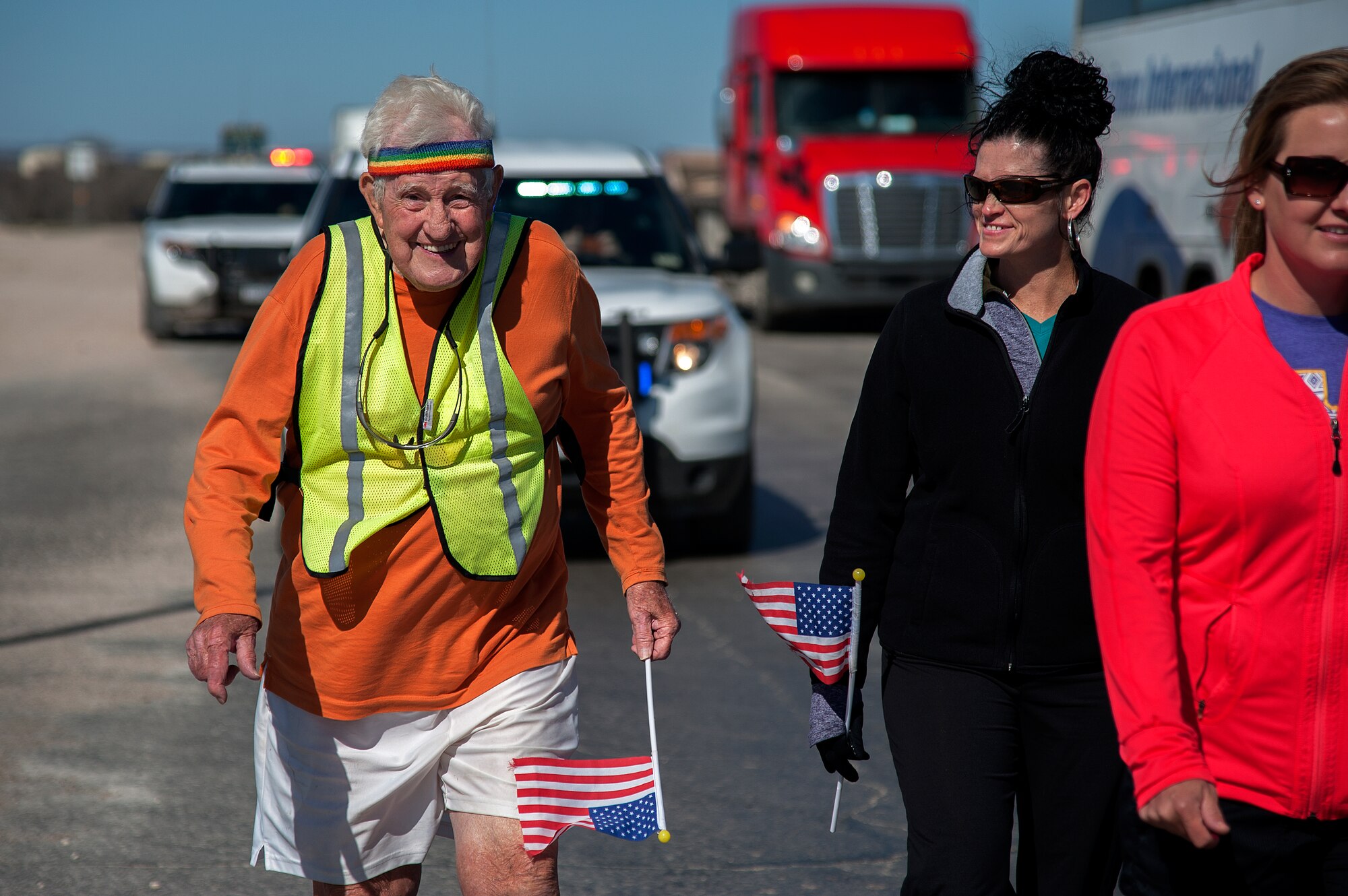 STERLING CITY, Texas -- Ernie Andrus, Navy World War II veteran, runs through Sterling City with locals March 26. Andrus is running coast to coast in hopes to raise enough money to return the USS LST-325, a tank landing ship, to Normandy for the 2019 D-Day memorial service. (U.S. Air force photo/ Airman 1st Class Devin Boyer)