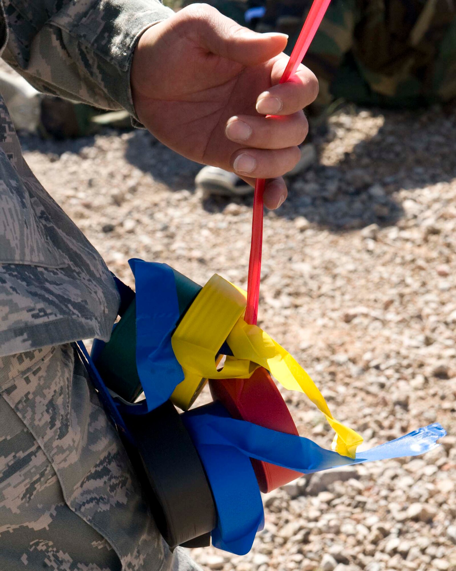 Colored medical tape isused to identify the severity of wounds on simulated casualties during Operation Joint Medic exercise at Nellis Air Force Base, Nev., March 27, 2015. The 926th Aerospace Medicine Squadron, 624th Aeromedical Staging Squadron, Joint Base Pearl Harbor-Hickam, Hawaii, Guam Army National Guard medical detachment, and the 66th Rescue Squadron participated in the exercise. (U.S. Air Force photo by Airman 1st Class Rachel Loftis)   