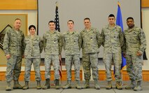 Col. Tom Wilcox, 341st Missile Wing commander (left) and Chief Master Sgt. Phillip Easton, 341st MW command chief (right) stand with five Airmen that received the Nuclear Deterrence Operations Service Medal during a commander’s call April 2 at the Grizzly Bend, Malmstrom Air Force Base, Mont. Wilcox said that the presentation of these medals to Airmen demonstrates the importance of awarding the medals earned for direct support of nuclear deterrence operations.  (U.S. Air Force photo/Staff Sgt. Delia Marchick)