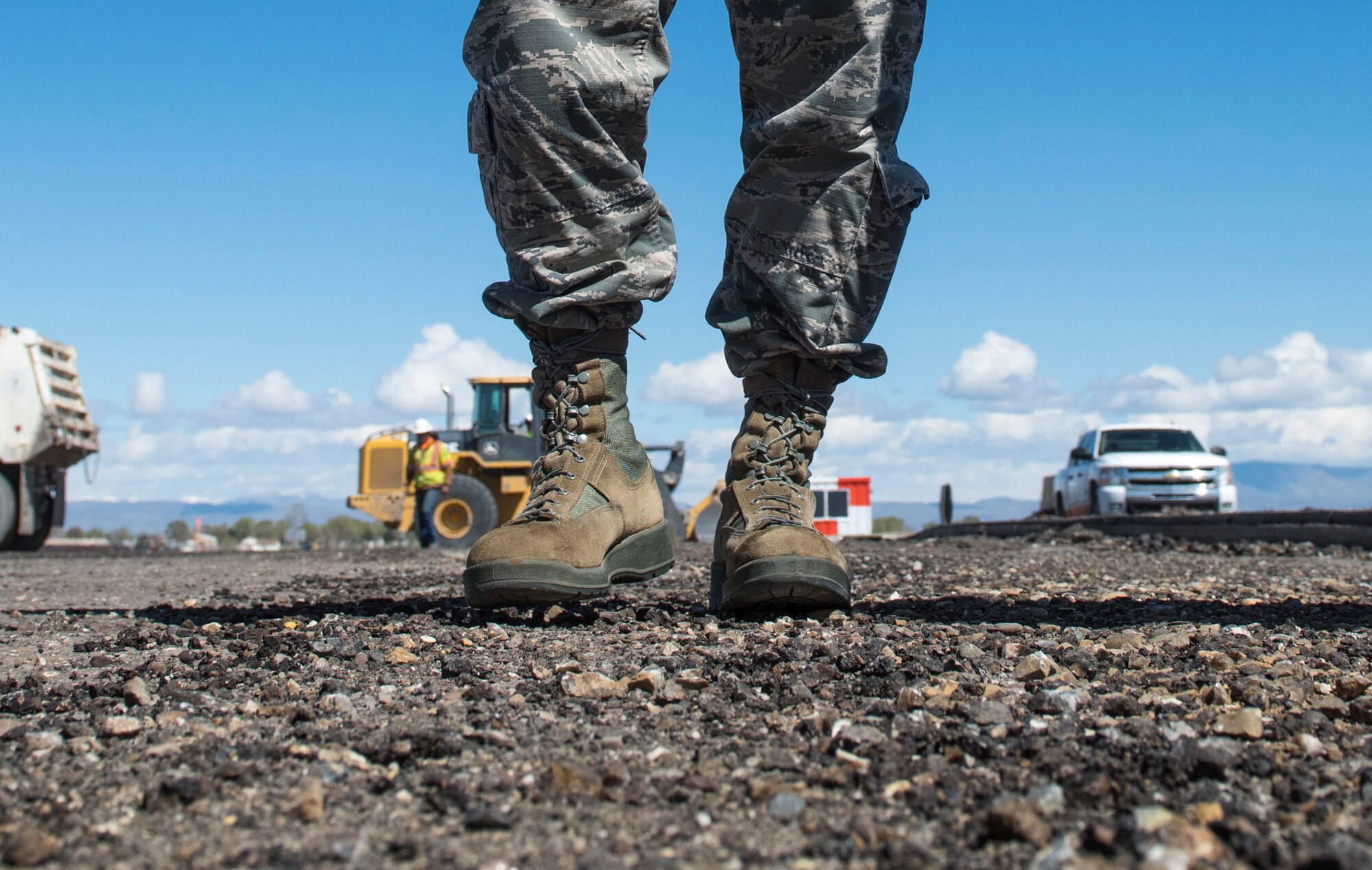 Lt. Gen. Chris Nowland, 12th Air Force (Air Forces Southern) commander, examines the condition of the runway under construction at Mountain Home Air Force Base, Idaho, April 1, 2015. The base’s runway trails others around Air Combat Command in terms of repair, and the construction project is aimed to make the runway safer for pilots and jets. (U.S. Air Force photo by Airman Connor J. Marth/RELEASED)