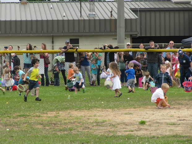 Kids hunt for Easter Eggs at the Air Base during the Month of the Military Child Easter Egg Hunt April 4, 2015 at Joint Base Charleston, S.C.. More than 1,100 people came out to the Easter egg hunts at the Air Base and Weapons Station. The Weapons Station event was hosted buy JB Charleston Youth Programs and the Air Base event was hosted by Youth Programs and the JB Charleston Libraries. Each event held egg hunts for youth, as well as provided fun activities such as ball tosses, face painting and coloring stations. The Easter Bunny also made an appearance at each location. (Courtesy Photo)