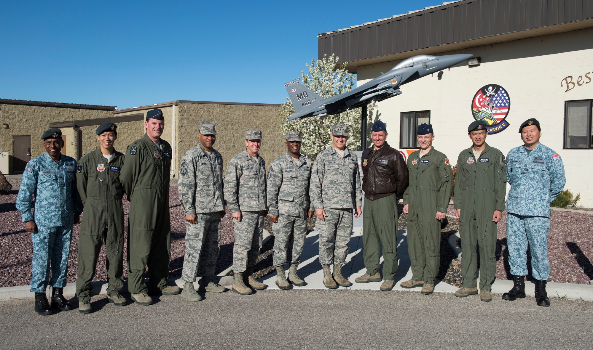 Lt. Gen. Chris Nowland, 12th Air Force (Air Forces Southern) commander, poses for a photo with base leaders and members of the 428th Fighter Squadron at Mountain Home Air Force Base, Idaho, April 1, 2015. The 428th FS is a detachment of the Republic of Singapore Air Force training with American Airmen on the Singaporean F-15SG fighter aircraft. (U.S. Air Force photo by Airman Connor J. Marth/RELEASED)