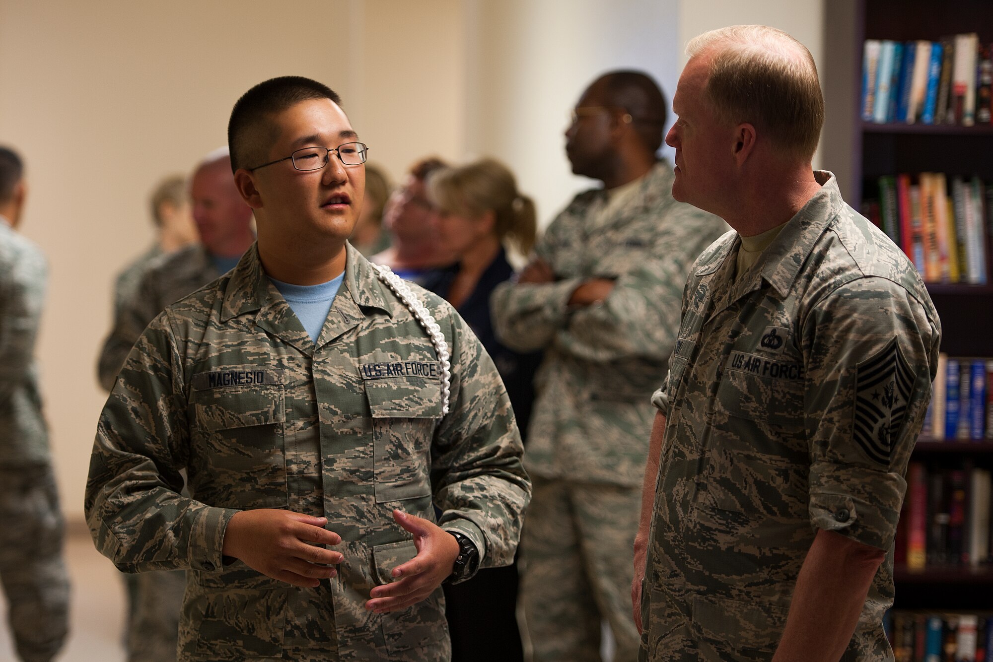 GOODFELLOW AIR FORCE BASE, Texas – Airman 1st Class Peter Magnesio, 316th Training Squadron student, speaks to Chief Master Sgt. of the Air Force James Cody at the Crossroads Student Center April 3. Cody toured the Crossroads, which gives students a reprieve from the training environment and the opportunity to interact with their fellow service members. (U.S. Air Force photo/ Airman 1st Class Devin Boyer)