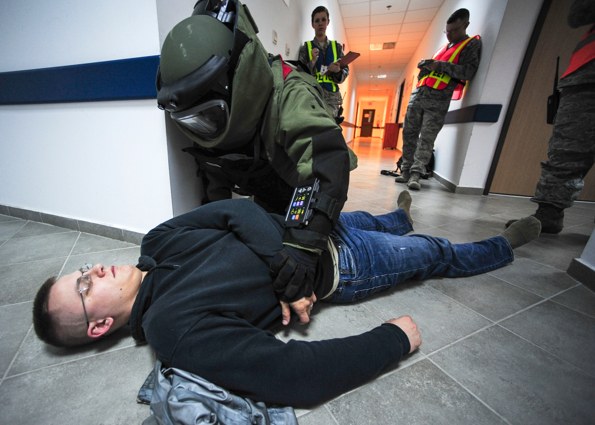 Staff Sgt. Alexander Blair, 39th Civil Engineer Explosive Ordinance Disposal journeyman, searches the body of a gunman during an active shooter exercise March 30, 2015, at Incirlik Air Base, Turkey. The 39th Air Base Wing Inspector General Team observed the exercise to assess first responder’s abilities in case of a real-world emergency. (U.S. Air Force photo by Airman 1st Class Cory W. Bush/Released)