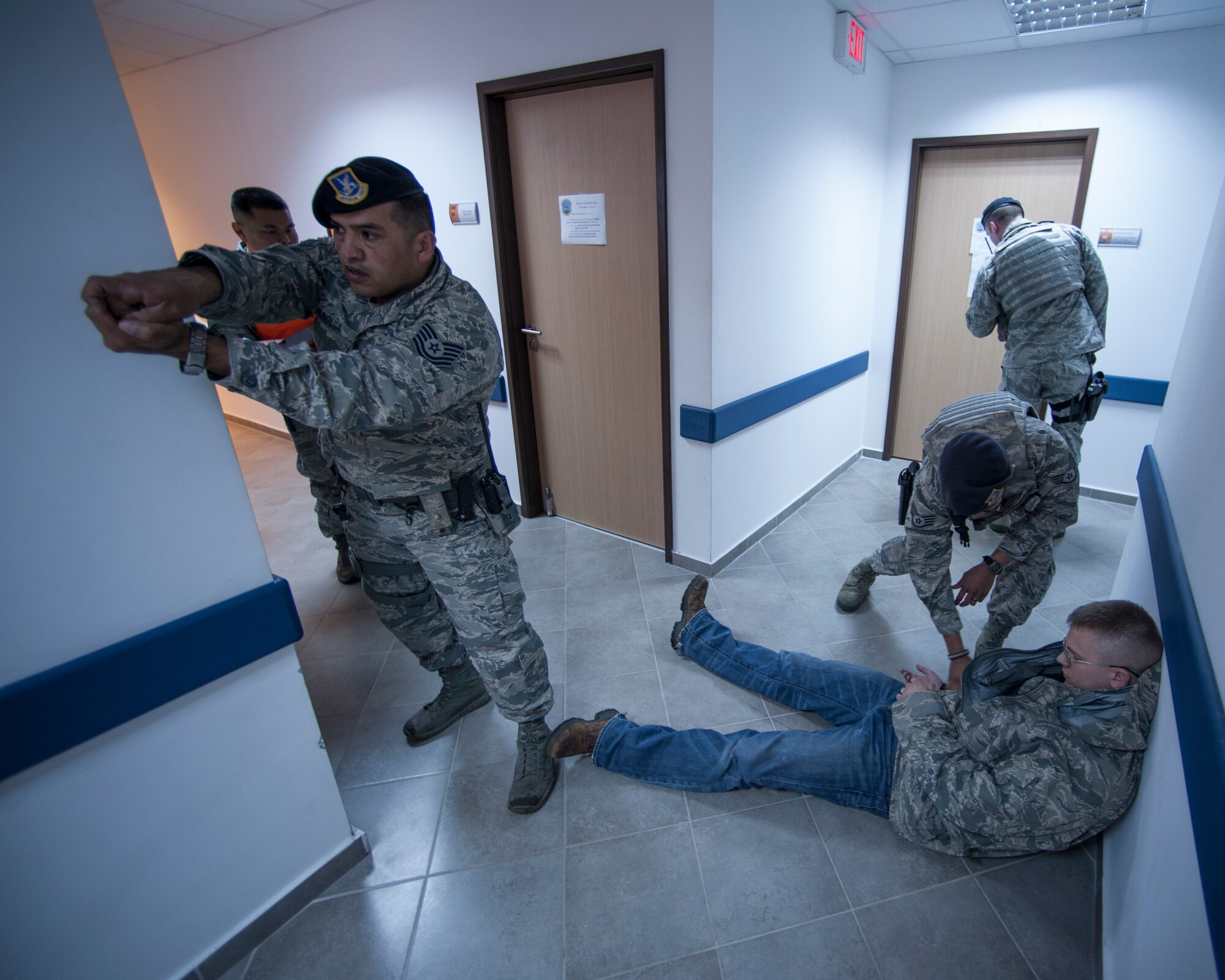 Tech Sgt. Esequiel Munguia, Staff Sgt. James Hartnett and Staff Sgt. Bryant Guillermo, 39th Security Forces Squadron patrolmen, search and secure the shooter’s body during an active shooter exercise March 30, 2015, at Incirlik Air Base, Turkey. First responders participated in the exercise as part of an assessment of their readiness and effectiveness in case of a real-world emergency. (U.S. Air Force photo by Airman 1st Class Cory W. Bush/Released)