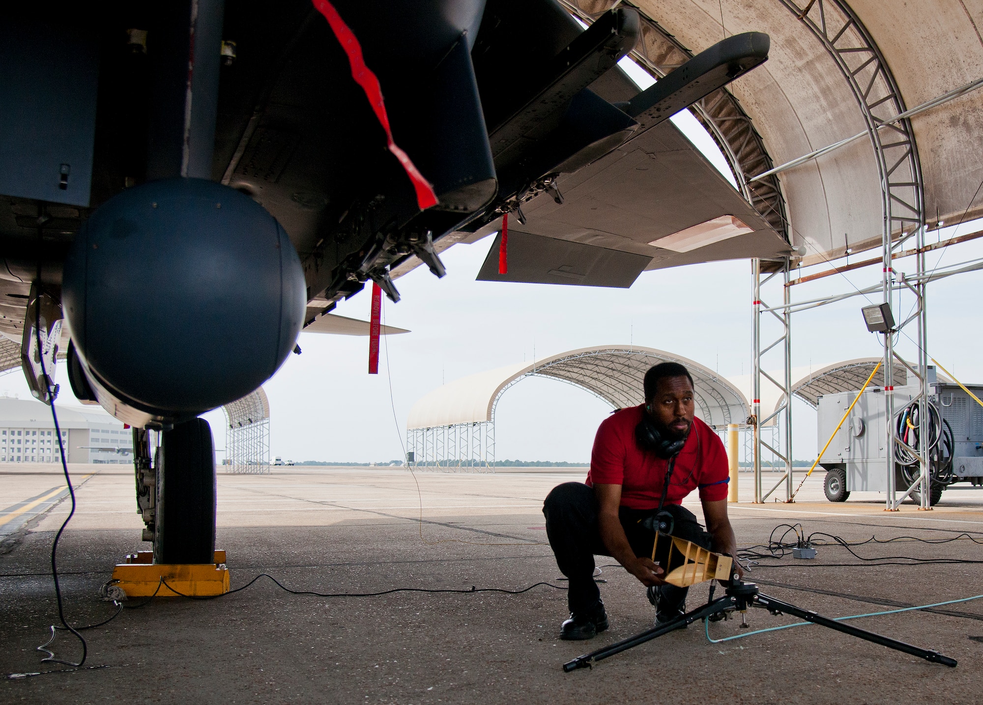 Samuel Burnham, Air Force Seek Eagle office, configures a horn antenna prior to an electromagnetic interference and compatibility test of a LITENING pod on an F-15 Eagle March 18 at Eglin Air Force Base, Fla.  The test will measure the frequencies put out by the pod and ensure those transmissions do not interfere with the safe operation of the aircraft.  While the testing is performed on the ground, the aircraft is running with aircrew performing various flight procedures and reporting any interference.  This test is directly related to the AFSEO mission of ensuring new warfighter capabilities through the application and transfer of aircraft-store compatibility expertise.  (U.S. Air Force photo/Samuel King Jr.)