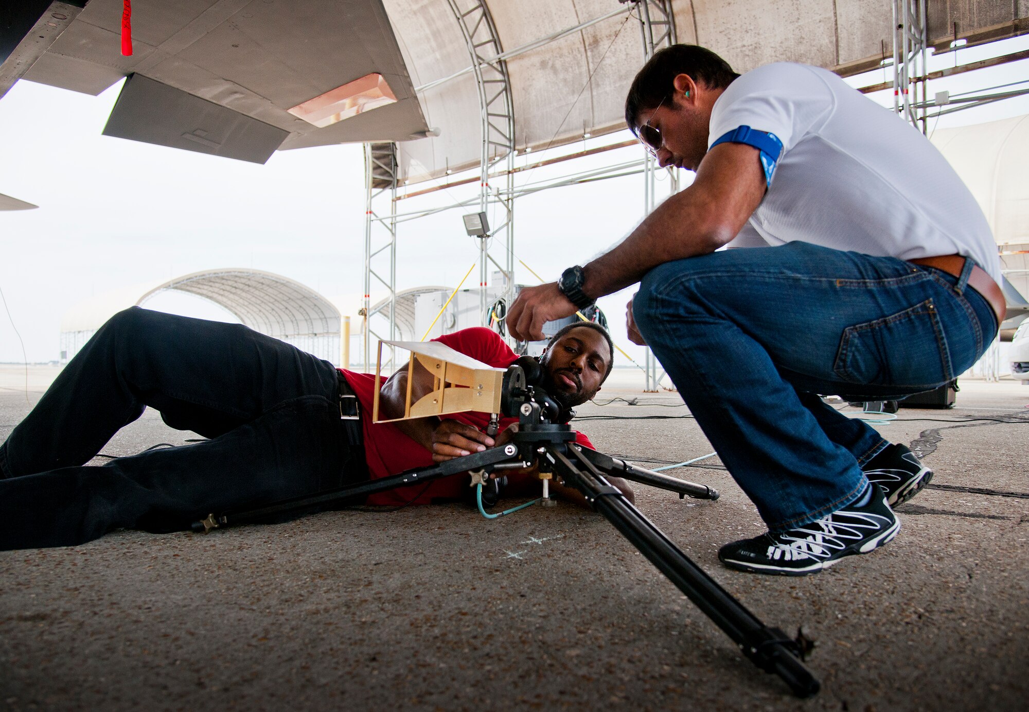 Samuel Burnham and Irvin Fontanes, Air Force Seek Eagle office, configure a horn antenna prior to an electromagnetic interference and compatibility test of a LITENING pod on an F-15 Eagle March 18 at Eglin Air Force Base, Fla.  The test will measure the frequencies put out by the pod and ensure those transmissions do not interfere with the safe operation of the aircraft.  While the testing is performed on the ground, the aircraft is running with aircrew performing various flight procedures and reporting any interference.  This test is directly related to the AFSEO mission of ensuring new warfighter capabilities through the application and transfer of aircraft-store compatibility expertise.  (U.S. Air Force photo/Samuel King Jr.)