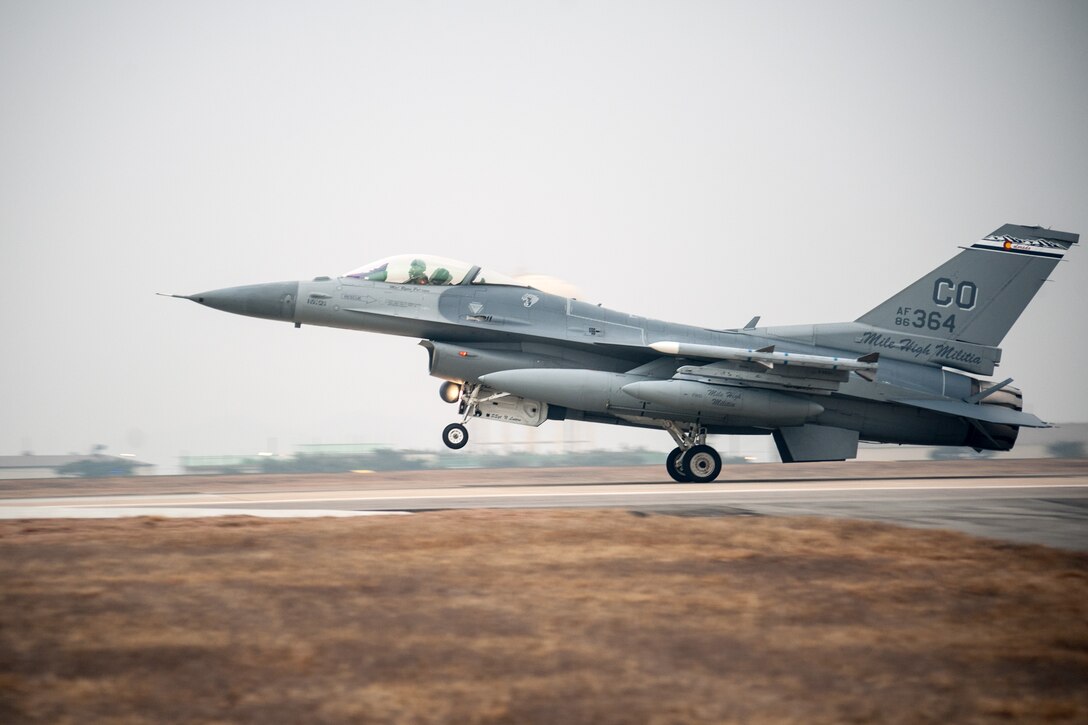 An F-16 Fighting Falcon from the 140th Wing, Colorado Air National Guard, touches down on the runway at Kunsan Air Base, Republic of Korea, Feb. 15, 2015. The 140th jets along with more than 200 Airmen are temporarily stationed at Kunsan for three to four months as part of a rotational Theater Security Package. (U.S. Air Force photo by Senior Airman Taylor Curry/Released) 