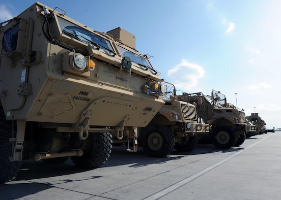 Tactical vehicles sit on the flightline prior to being transported to an aircraft in support of retrograde operations March 20, 2015 at Kandahar Airfield, Afghanistan. At the height of retrograde in 2014, Airmen assigned to the 451st Expeditionary Logistics Readiness Squadron were responsible for shipping more than 9,000 tons of cargo each month. (U.S. Air Force photo by Staff Sgt. Whitney Amstutz/released)