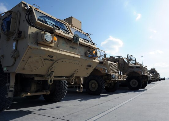 Tactical vehicles sit on the flightline prior to being transported to an aircraft in support of retrograde operations March 20, 2015 at Kandahar Airfield, Afghanistan. At the height of retrograde in 2014, Airmen assigned to the 451st Expeditionary Logistics Readiness Squadron were responsible for shipping more than 9,000 tons of cargo each month. (U.S. Air Force photo by Staff Sgt. Whitney Amstutz/released)