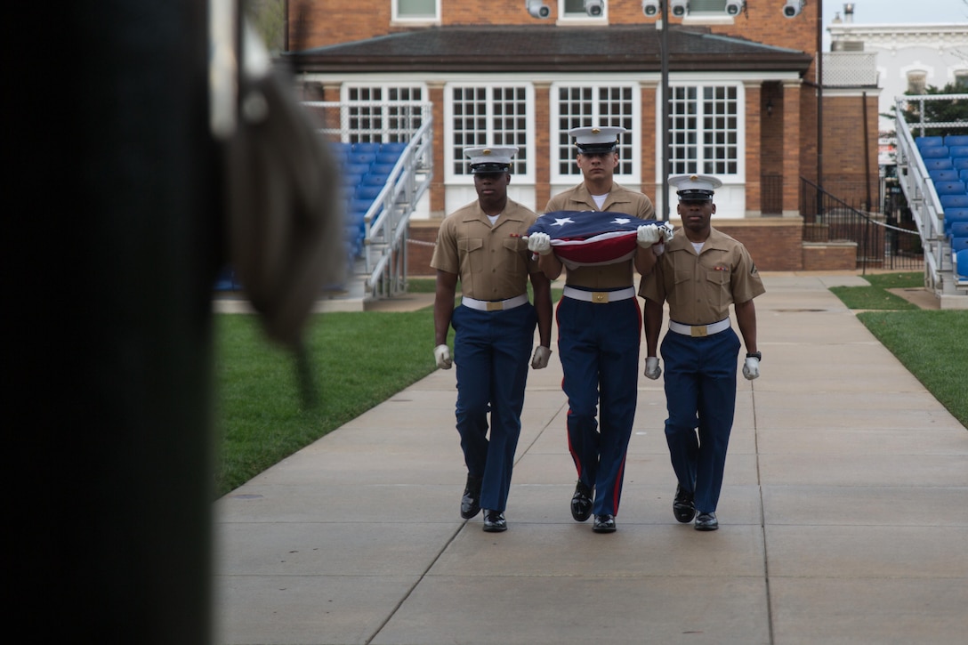 Cpl. Raymond Guzman, Lance Cpl. Alton Coverly and Lance Cpl. Marcus Allen, color detail, march out to perform morning colors at Marine Barracks Washington, D.C. April 7, 2015. Marines are hand-selected for the morning and evening color detail which lasts for approximately six months. (U.S. Marine Corps photo by Cpl. Christian Varney/Released)