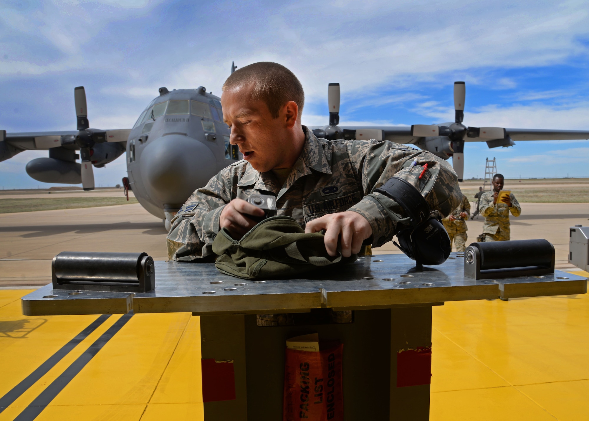 U.S. Air Force Airman 1st Class David Coulter, 27th Special Operations Maintenance Squadron AC-130 armament shop, preps a multi-purpose adapter for munitions transition during a load competition April 6, 2015 at Cannon Air Force Base, N.M. Cannon’s elite weapons Air Commandos gathered in a newly renovated hangar for a bit of friendly competition geared toward promoting pride within their career field and a sense of camaraderie among crew members. (U.S. Air Force photo/Staff Sgt. Alex Mercer)