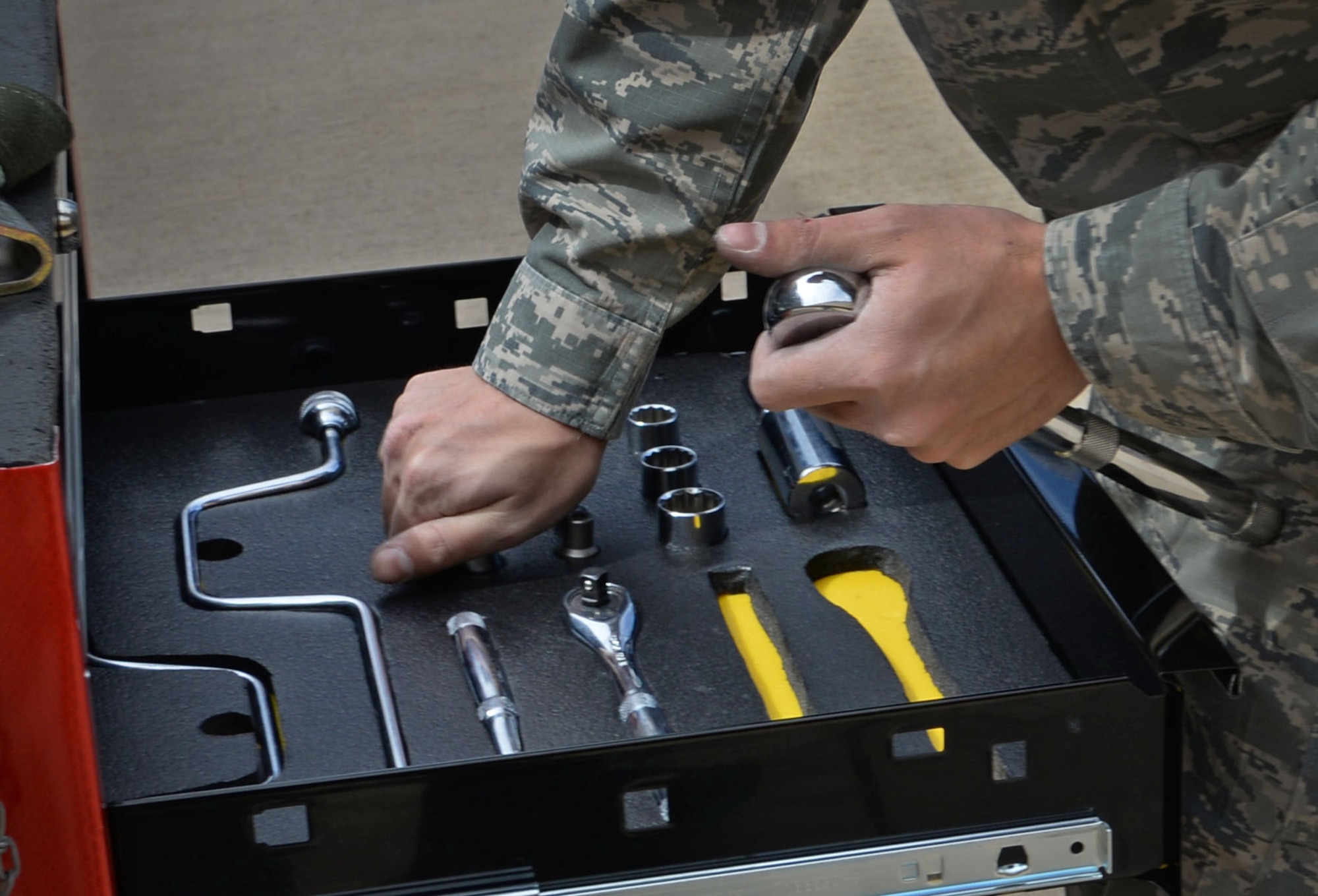 U.S. Air Force Airman 1st Class Ryan Burtis, 27th Special Operations Maintenance Squadron AC-130 armament shop, stores all tools required during a load competition April 6, 2015 at Cannon Air Force Base, N.M. This was one of the final tasks accomplished by the AC-130W team before objective completion. (U.S. Air Force photo/Staff Sgt. Alex Mercer)