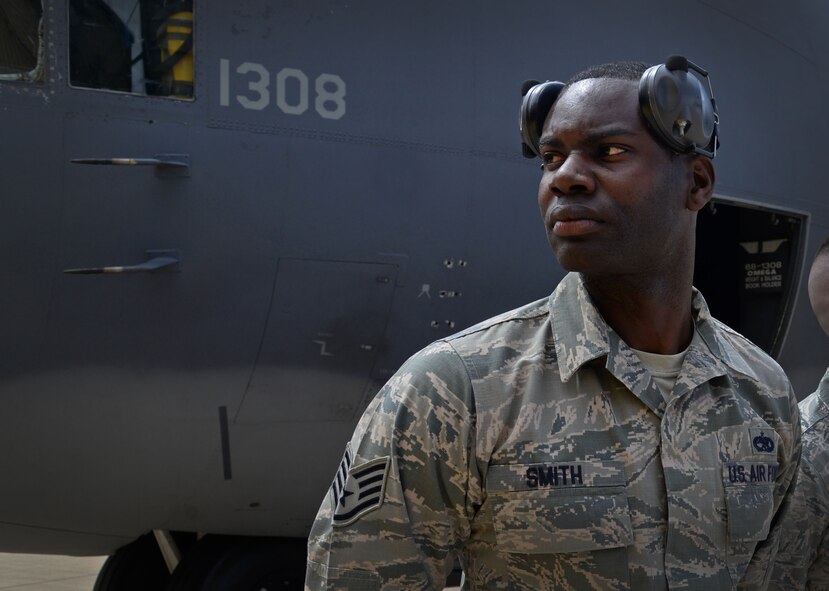 U.S. Air Force Staff Sgt. Olin Smith, 27th Special Operations Maintenance Squadron AC-130 armament shop, observers competitors from the MQ-9 load team after his AC-130W team finishes their objective first April 6, 2015 at Cannon Air Force Base, N.M. While the AC-130 load team finished first, spectators were left with a bit of a cliffhanger ending, as it was announced that the results of the completion would not be released until the Maintenance Professional of the Year award banquet on April 24. (U.S. Air Force photo/Staff Sgt. Alex Mercer)