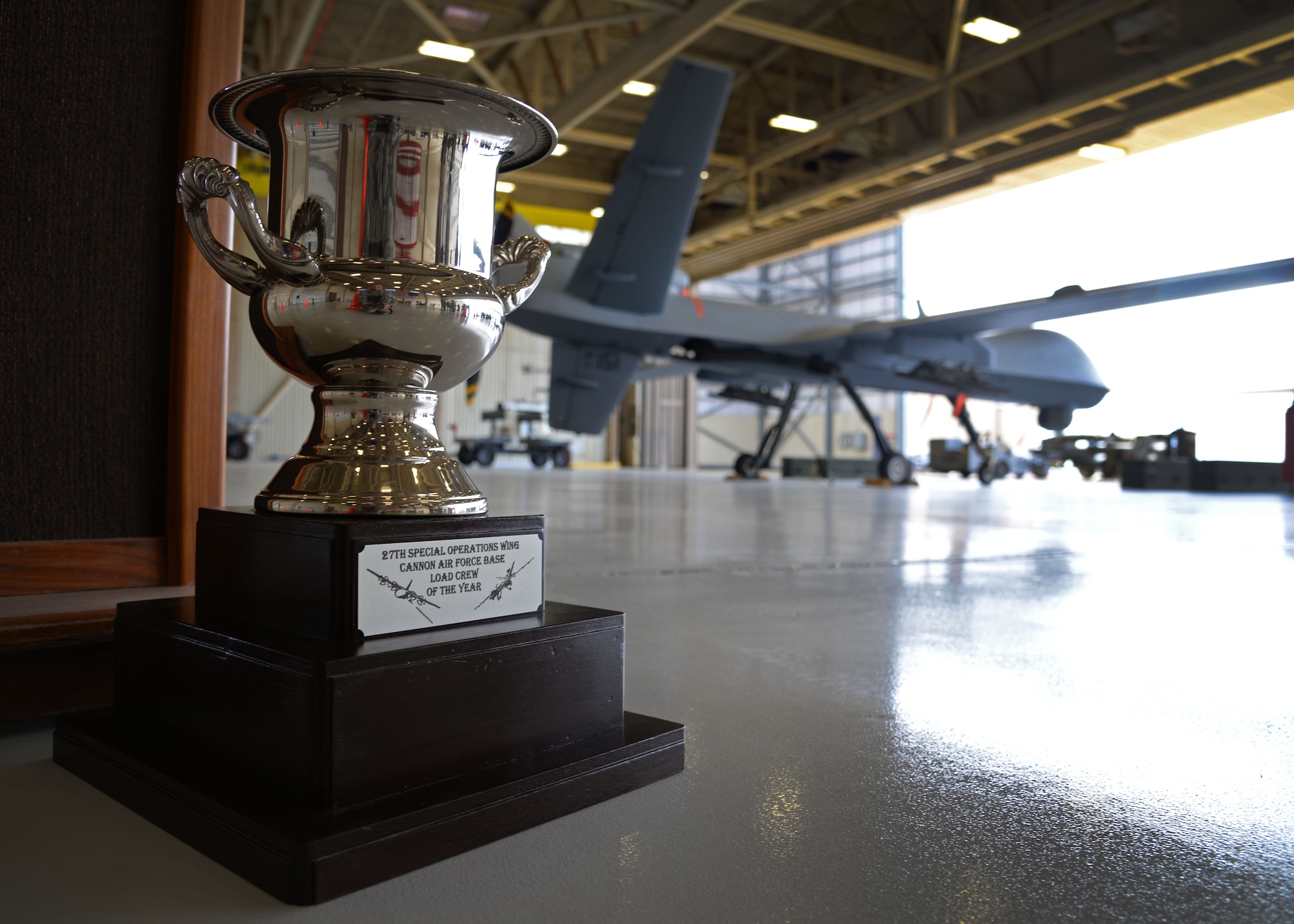 The 27th Special Operations Wing load crew of the year trophy is displayed near competition grounds April 6, 2015 at Cannon Air Force Base, N.M. Cannon’s weapons troops gathered for the first ever load competition in Air Force Special Operations Command history. (U.S. Air Force photo/Staff Sgt. Alex Mercer)