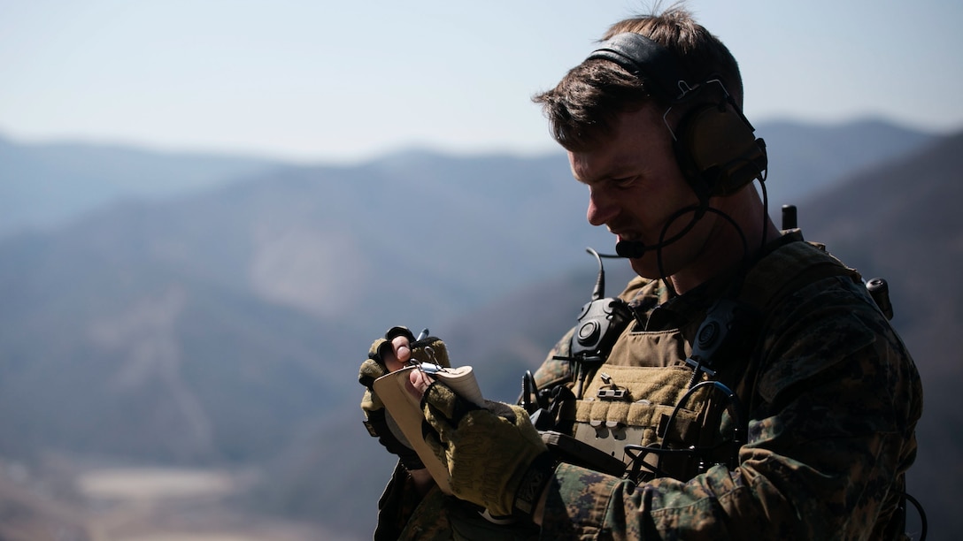 U.S. Marine Capt. Joseph R. Mozzi takes notes March 26 at Pilsung Range in South Korea. The Marines completed a week of fire support coordination training with Republic of Korea Marines as part of Korean Marine Exchange Program 15-14.2, a small-unit training exercise, which enhances the combat readiness and interoperability of the two forces. Mozzi, from Dalton, Massachusetts, is a joint terminal attack controller with 5th Air Naval Gunfire Liaison Company, III Marine Expeditionary Force Headquarters Group, III MEF.