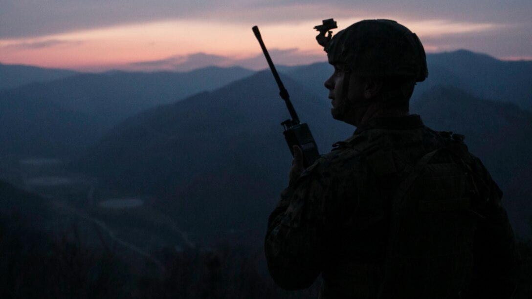 U.S. Marine Staff Sgt. Matthew D. Faust speaks with pilots via radio March 27 at Pilsung Range in South Korea. The Marines completed a week of fire support coordination training with Republic of Korea Marines as part of Korean Marine Exchange Program 15-14.2, a small-unit training exercise, which enhances the combat readiness and interoperability of the two forces. Faust, from Clayton, New York, is a joint terminal attack controller with 5th Air Naval Gunfire Liaison Company, III Marine Expeditionary Force Headquarters Group, III MEF. 