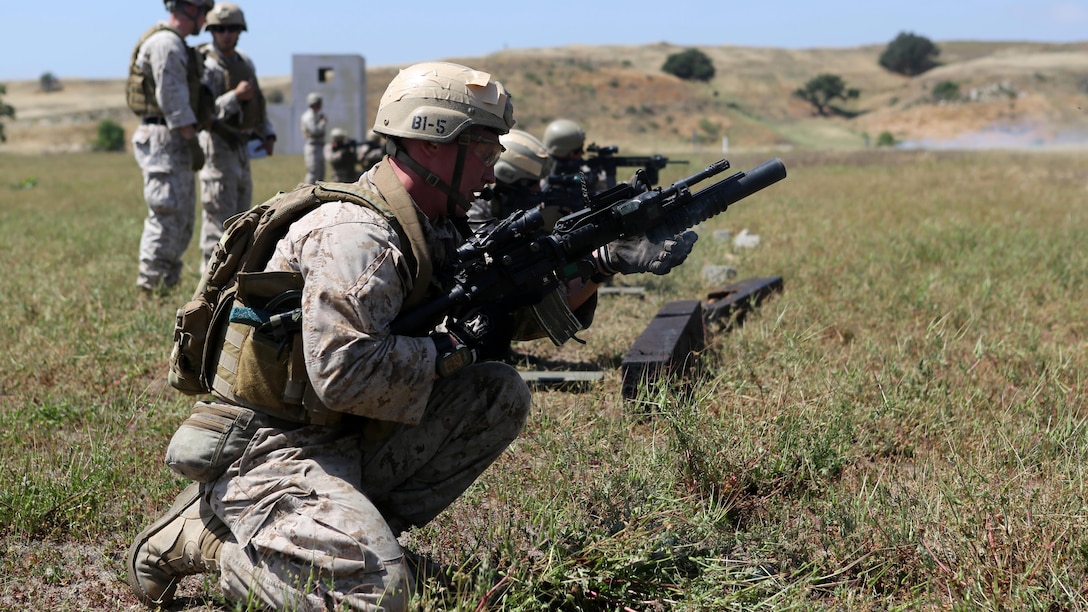 Sergeant Wesley Ferguson, assistant team leader, Charlie Company, 1st Reconnaissance Battalion, reloads an M203 grenade launcher during a live-fire raid at Range 226 aboard Marine Corps Base Camp Pendleton, California, April 1, 2015. Ferguson, a native of Lehi, Utah, and the company conducted the live-fire exercise as part of a pre deployment workup in support of the 13th Marine Expeditionary Unit. (U.S. Marine Corps photo by Sgt. Joseph Scanlan / released)