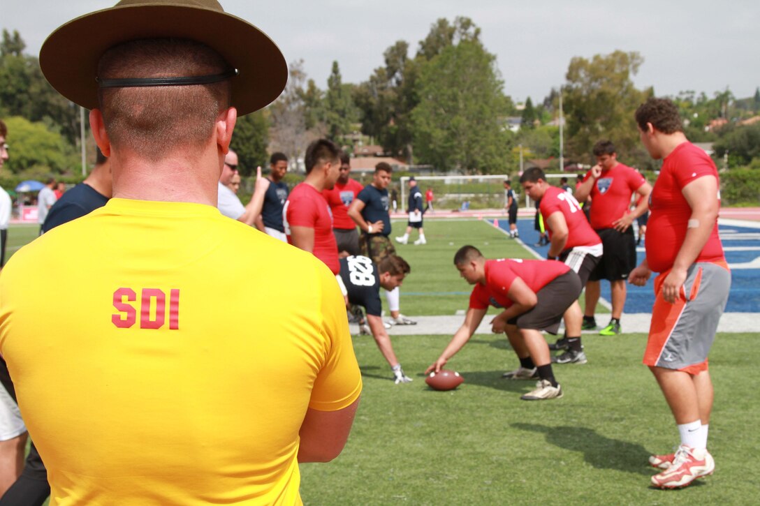 Approximately 120 athletes participate in drills during the Semper Fidelis All-American Football Camp March 22, 2015. These Camps are the first phase of the Semper Fidelis Football Program. Open to high schools students in 9th, 10th and 11th grade, Semper Fidelis All-American Camps not only hone football skills, but also teach players about Marine Corps values both on and off the field.