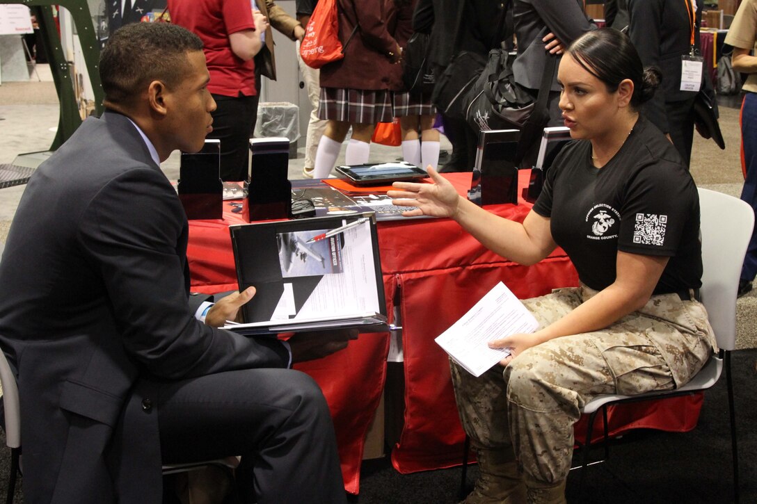 Gunnery Sgt. Shannon Umana, a Marine recruiter with Recruiting Station Orange County’s Officer Selection team, talks to a National Society of Black Engineers career fair participant about the opportunities available in the Marine Corps during the 2015 NSBE Convention March 27, 2015. Investing in a diverse and representative officer corps will help generate and sustain a future force that has cultural expertise, language skill sets and a variety of philosophies needed to meet operational requirements in the Marines. It was also an opportunity to reinforce the idea of the armed forces as viable career option within the African-American community.