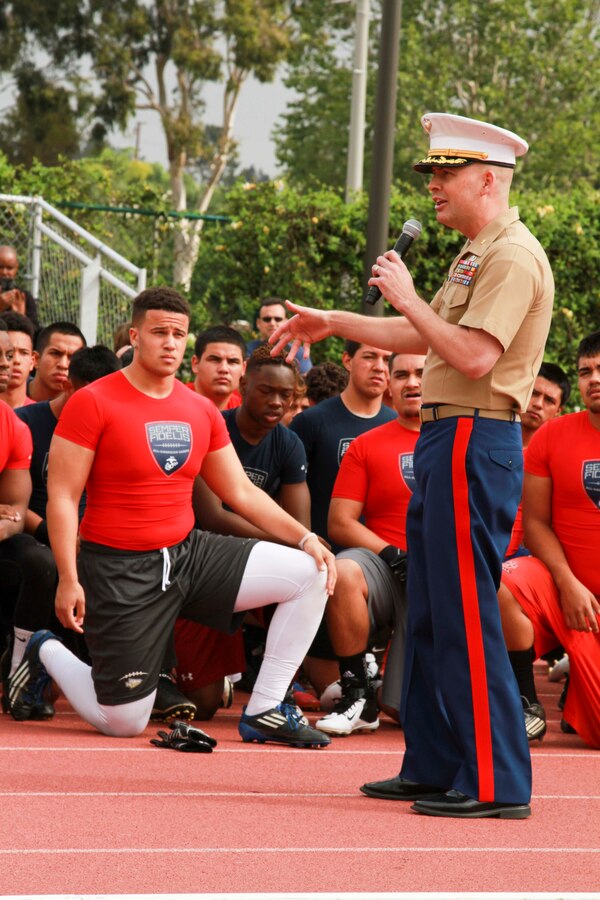 Maj. James P. Dollard, Marine Corps Recruiting Station Orange County commanding officer, talks to participants about the importance of enthusiasm during the Semper Fidelis All-American Football Camp March 22, 2015. These Camps are the first phase of the Semper Fidelis Football Program. Open to high schools students in 9th, 10th and 11th grade, Semper Fidelis All-American Camps not only hone football skills, but also teach players about Marine Corps values both on and off the field.