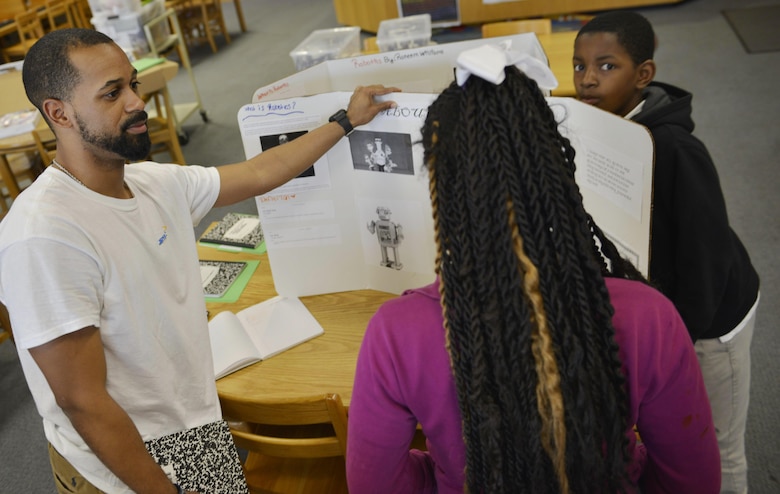 Canton Gardenhire, Corps Internal Review specialist, helps prepare sixth-grade student Jabria for a robotics presentation April 1 at DeRenne Middle School in Savannah. Gardenhire devotes two Wednesdays each month collaborating with students on projects covering physics, chemistry sciences, technology, engineering, mathematics operations and applications and STEM careers.  The Starbase program is a Department of Defense educational initiative designed to expose at-risk youth to the science, technology, engineering and math (STEM) disciplines, both on and off military installations