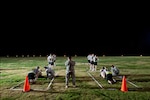 Cadre members from the Army National Guard’s Warrior Training Center conduct an Army Physical Fitness Test for participants in the 2010 Best Warrior competition on Stewart Field at Fort Benning, Ga., July 30, 2010. The Soldier and non-commissioned officer who win the competition will go on to compete in the All-Army competition.