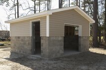 Marines with 8th Engineer Support Battalion, 2nd Marine Logistics Group, completed the construction of a storage facility, April 2, 2015, aboard Camp Lejeune, N.C. The project was used as training for an upcoming deployment. The unit will use the same skills to build schools and other facilities overseas. “I think the Marines did very well, said Sgt. Christopher Panko, a combat engineer with 8th ESB and Springfield, Pa., native. “Starting at the beginning, they didn’t know very much at all – we had to teach them a lot of things, but now that we’re done with it I think they learned a lot – I learned a lot. I think everything turned out really well.” (U.S. Marine Corps photo by Cpl. Elizabeth A. Case/Released)