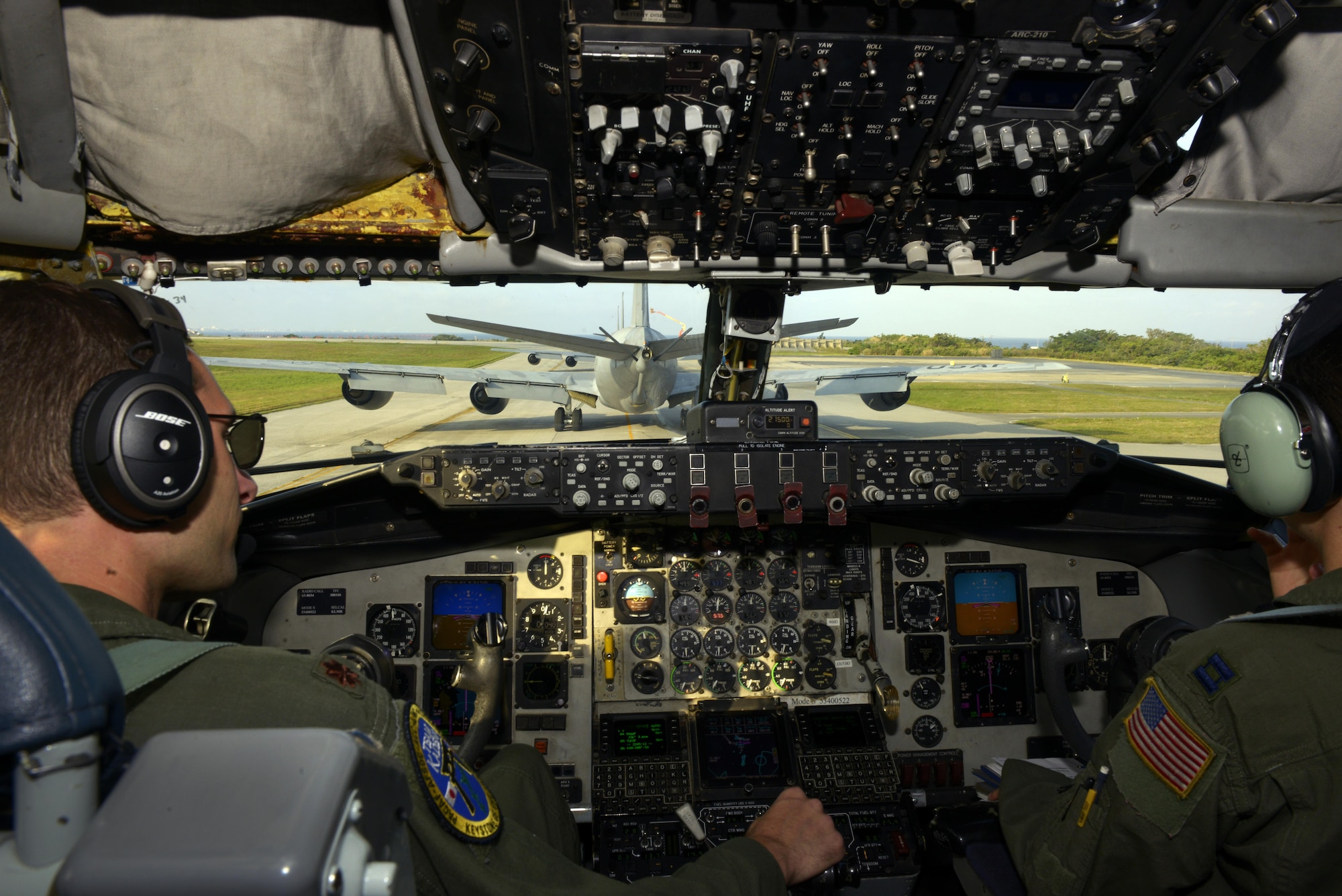 Maj. Christopher Marriott and Capt. Alexandra Trana, both KC-135 Stratotanker pilots from the 909th Air Refueling Squadron, taxi behind several KC-135s during an elephant walk as part of the Forceful Tiger exercise on Kadena Air Base, Japan, April 1, 2015. During the aerial exercise, the Stratotankers delivered 800,000 pounds of fuel to approximately 50 aircraft. (U.S. Air Force photo/Staff Sgt. Maeson L. Elleman)