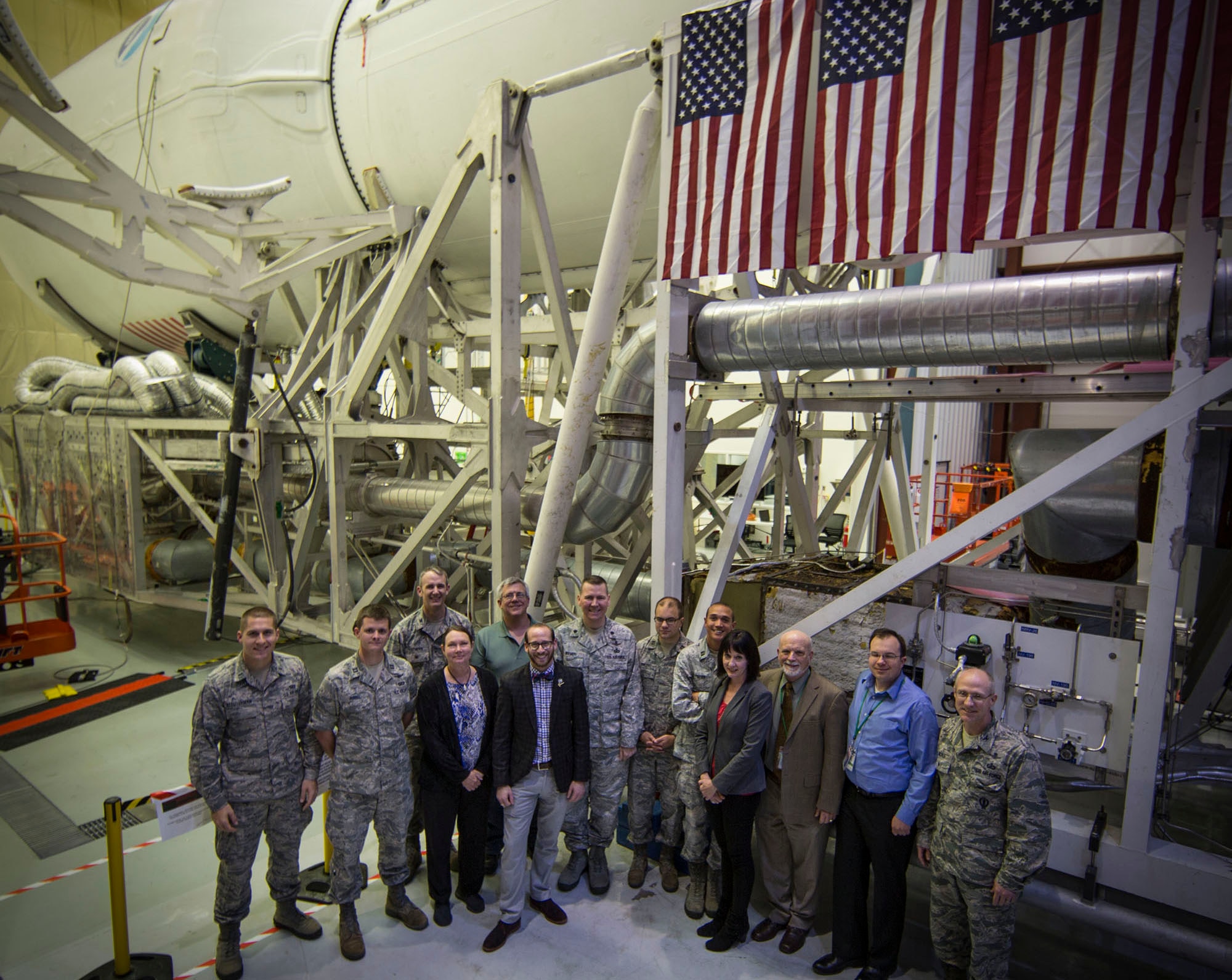 The SMC Falcon 9 / DSCOVR Launch Team is pictured (left to right): Lt. Kevin Steuterman, Capt. Eric Bunnel, Col. Jason Cothern, Sandra McIntosh, Dan Hauck, Matt Kanter, Lt. Col. Jeff Wiemeri, Capt. Oba Vincent, Capt. Dan Tillier, Shelley Guard, Ron Miller, Will Emmer and Col. Kent Nickle 