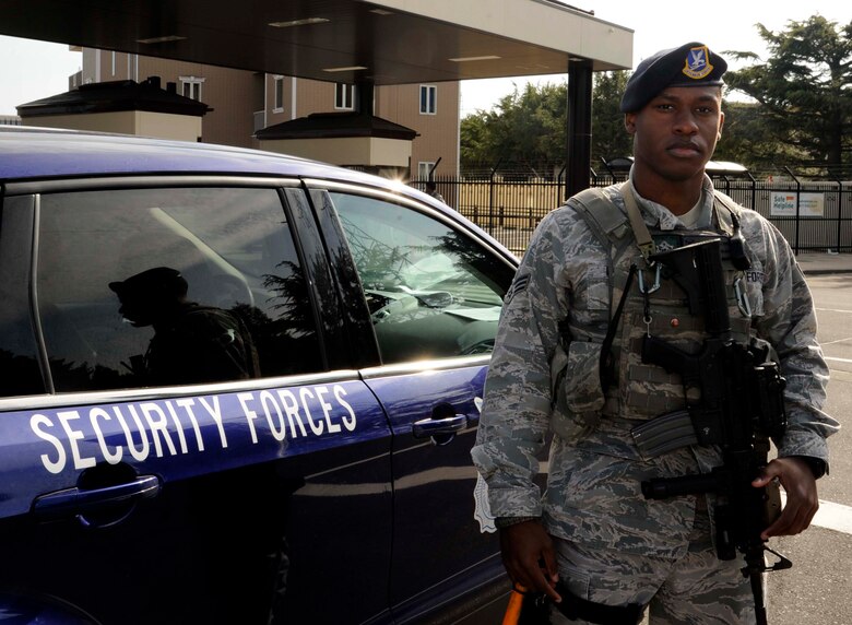 U.S. Air Force Senior Airman Brandon J. Beckford, 35th Security Forces Squadron security and response team leader, poses for a photo in front of the main gate at Misawa Air Base, Japan, April 2, 2015. Beckford’s daily mission is to protect the people, property and resources at Misawa. (U.S. Air Force photo by Airman 1st Class Jordyn Rucker/Released)