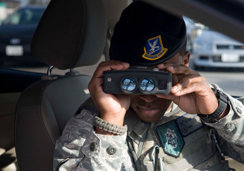 U.S. Air Force Senior Airman Brandon J. Beckford, 35th Security Forces Squadron security and response team leader, uses a Light Detection and Ranging speed gun to accurately pinpoint the speed of a vehicle in traffic at Misawa Air Base, Japan, April 2, 2015. Beckford’s duties include security patrol, conducting investigations, tactical drills, and securing crime scenes. (U.S. Air Force photo by Airman 1st Class Jordyn Rucker/Released)